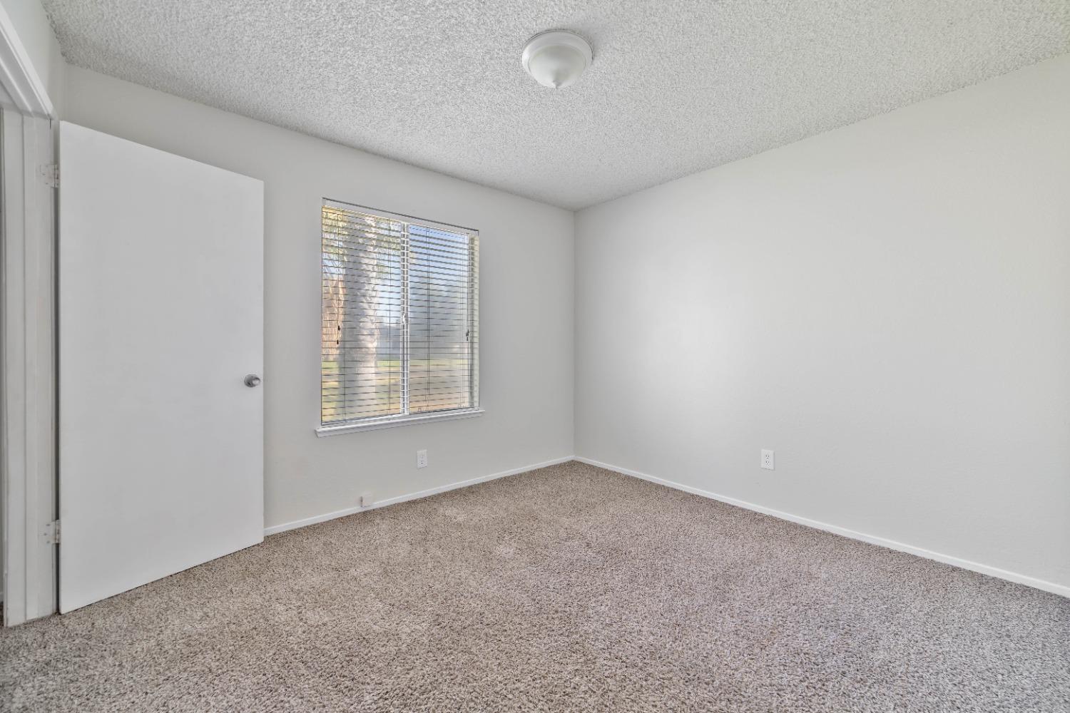 25612 Walden Avenue Madera, CA 93638 - Photo 24 of 33 a view of an empty room with a window