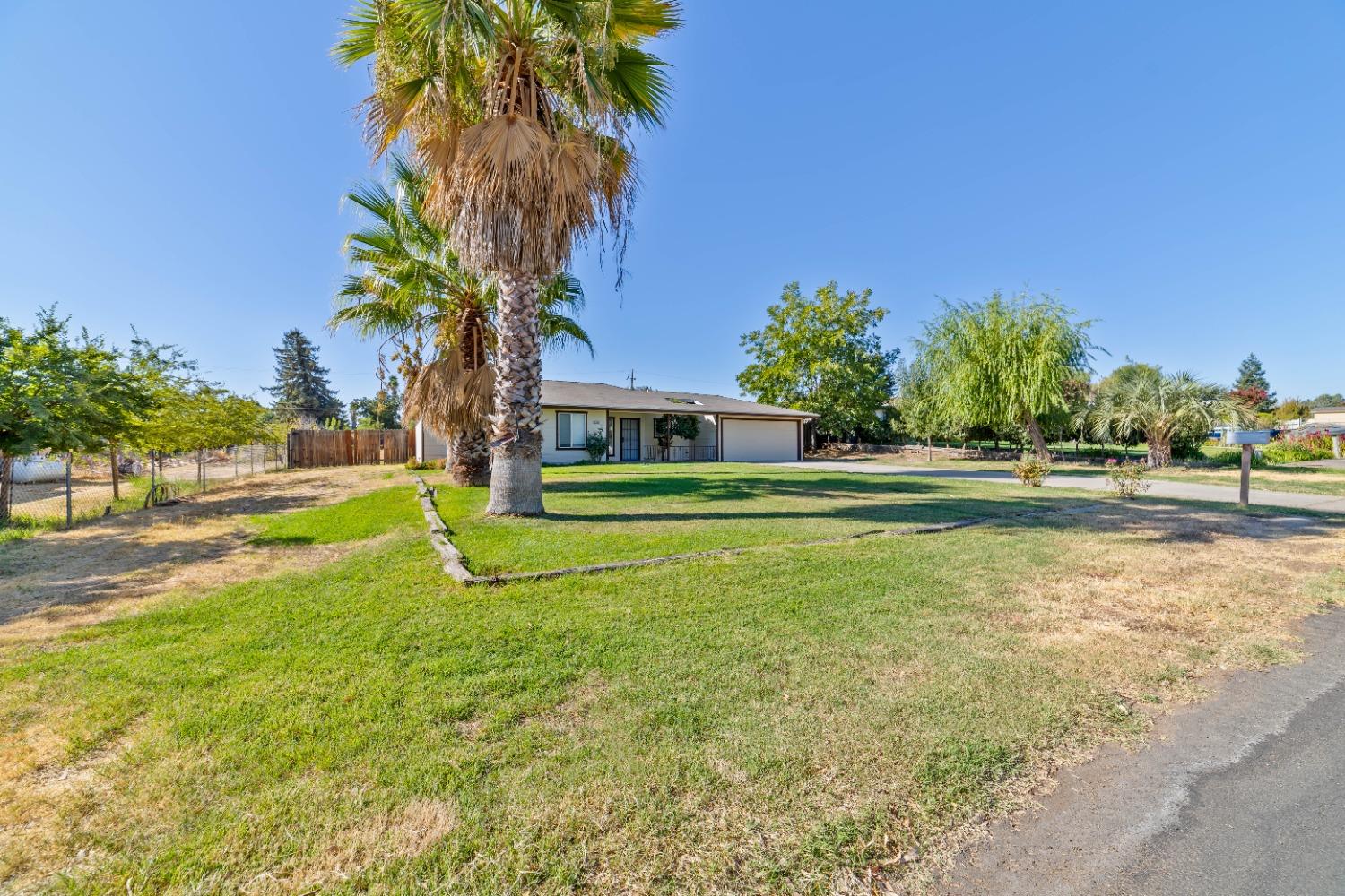 25612 Walden Avenue Madera, CA 93638 - Photo 30 of 33 a view of a house with a big yard