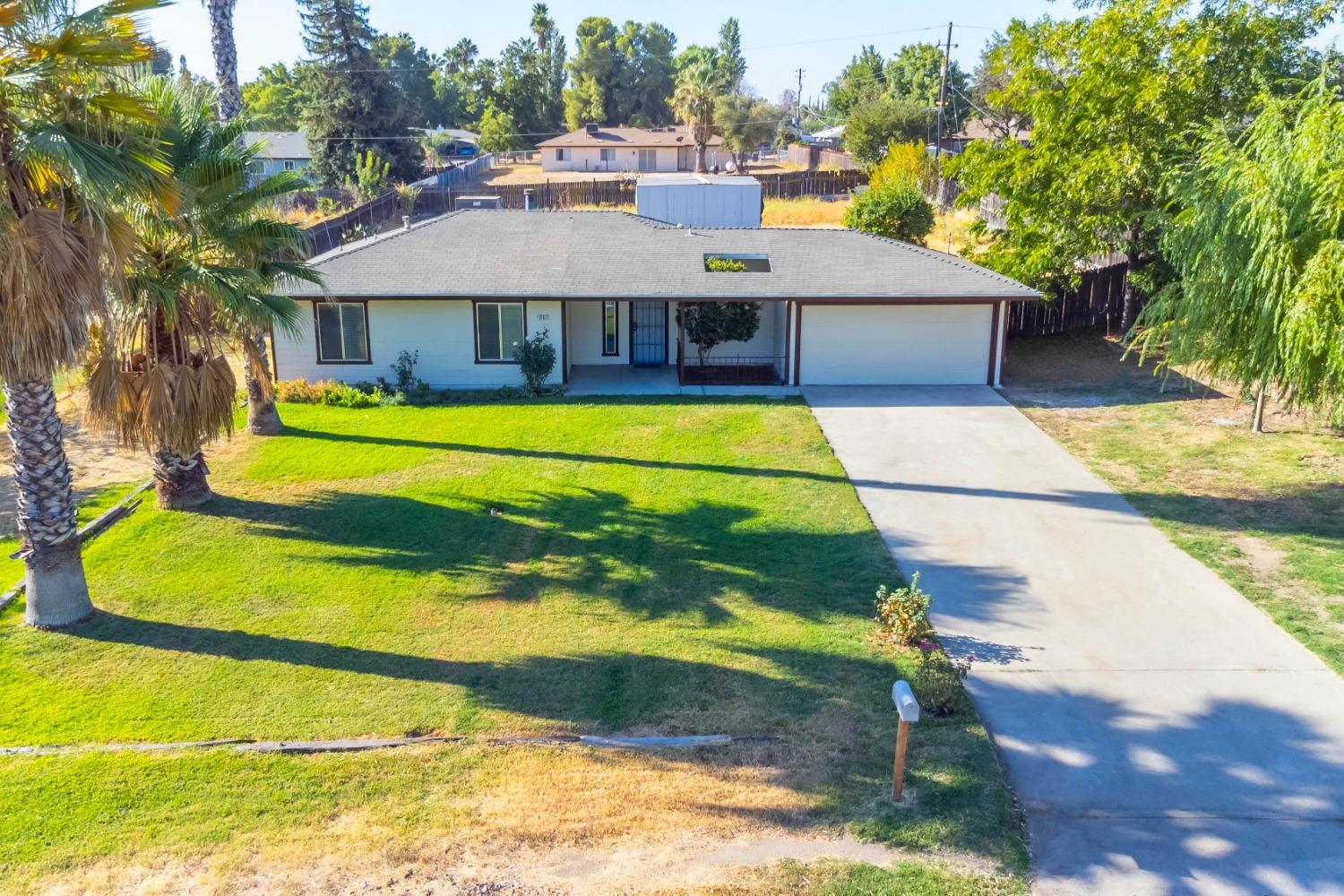 25612 Walden Avenue Madera, CA 93638 - Photo 3 of 33 a aerial view of a house with swimming pool