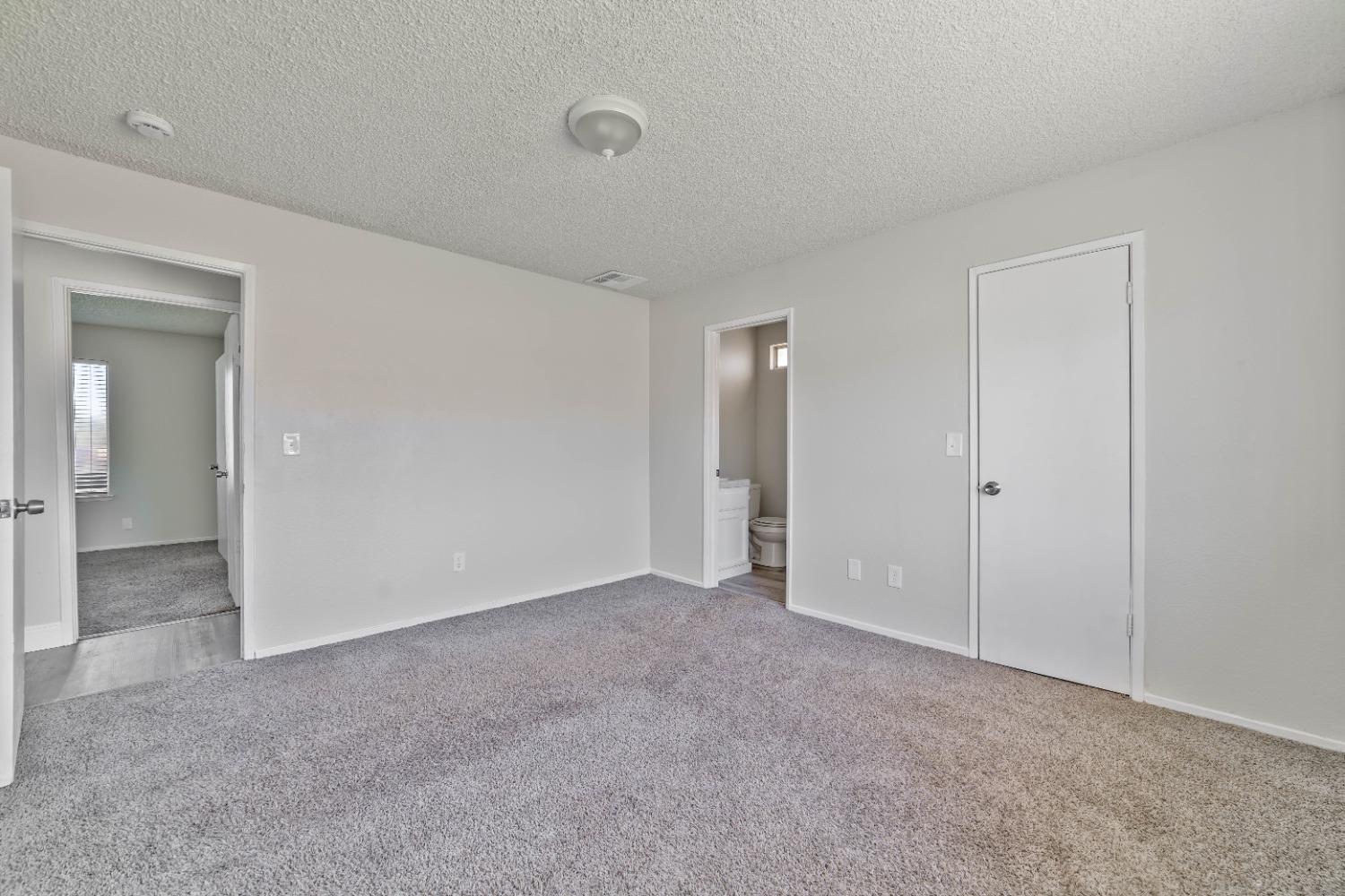 25612 Walden Avenue Madera, CA 93638 - Photo 9 of 33 a view of an empty room and closet