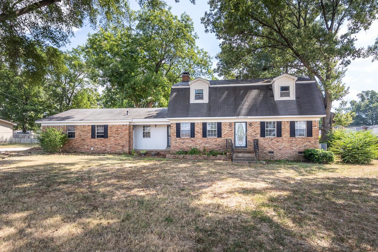 2718 Kate Bond Road Memphis, TN 38133 - Photo 38 of 39 Dutch colonial with crawl space, brick siding, a chimney, a front yard, and a shingled roof