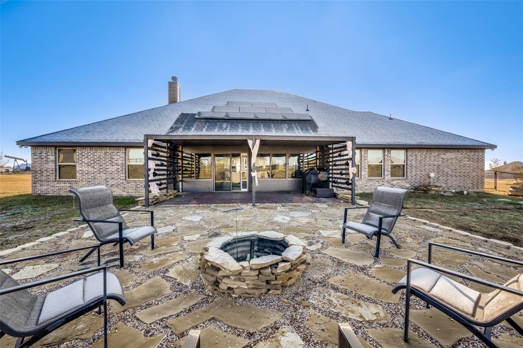 7417 Green Mesa Road Ponder, TX 76259 - Photo 32 of 39 a front view of a house with patio