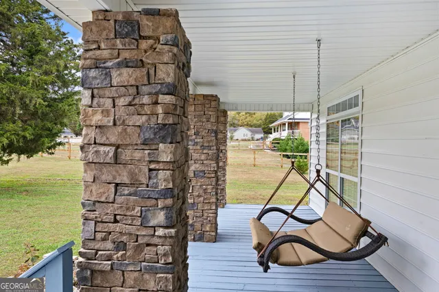 a view of staircase with a table and chairs