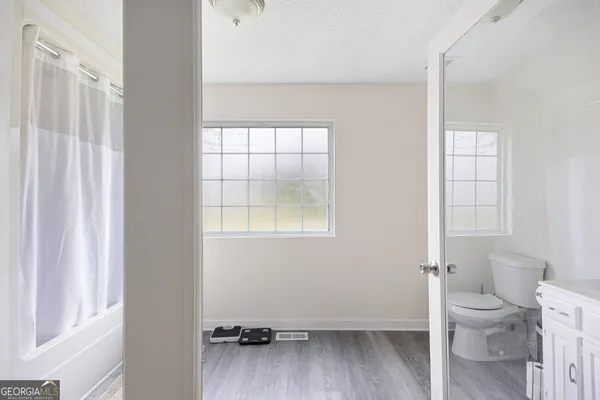 a view of an empty room with a window