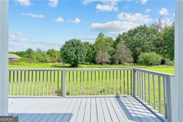 a view of balcony with wooden floor