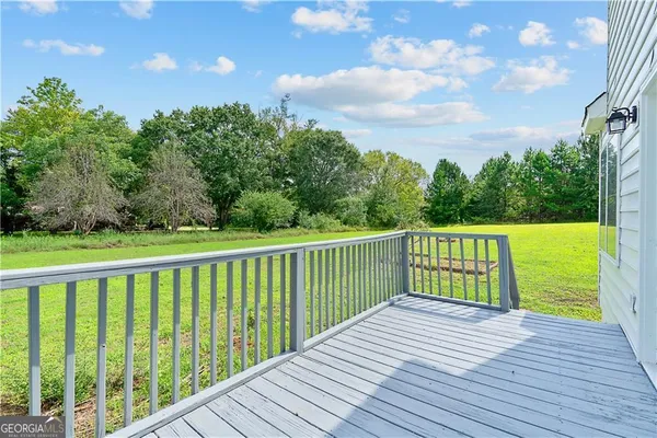 a view of a balcony with wooden floor