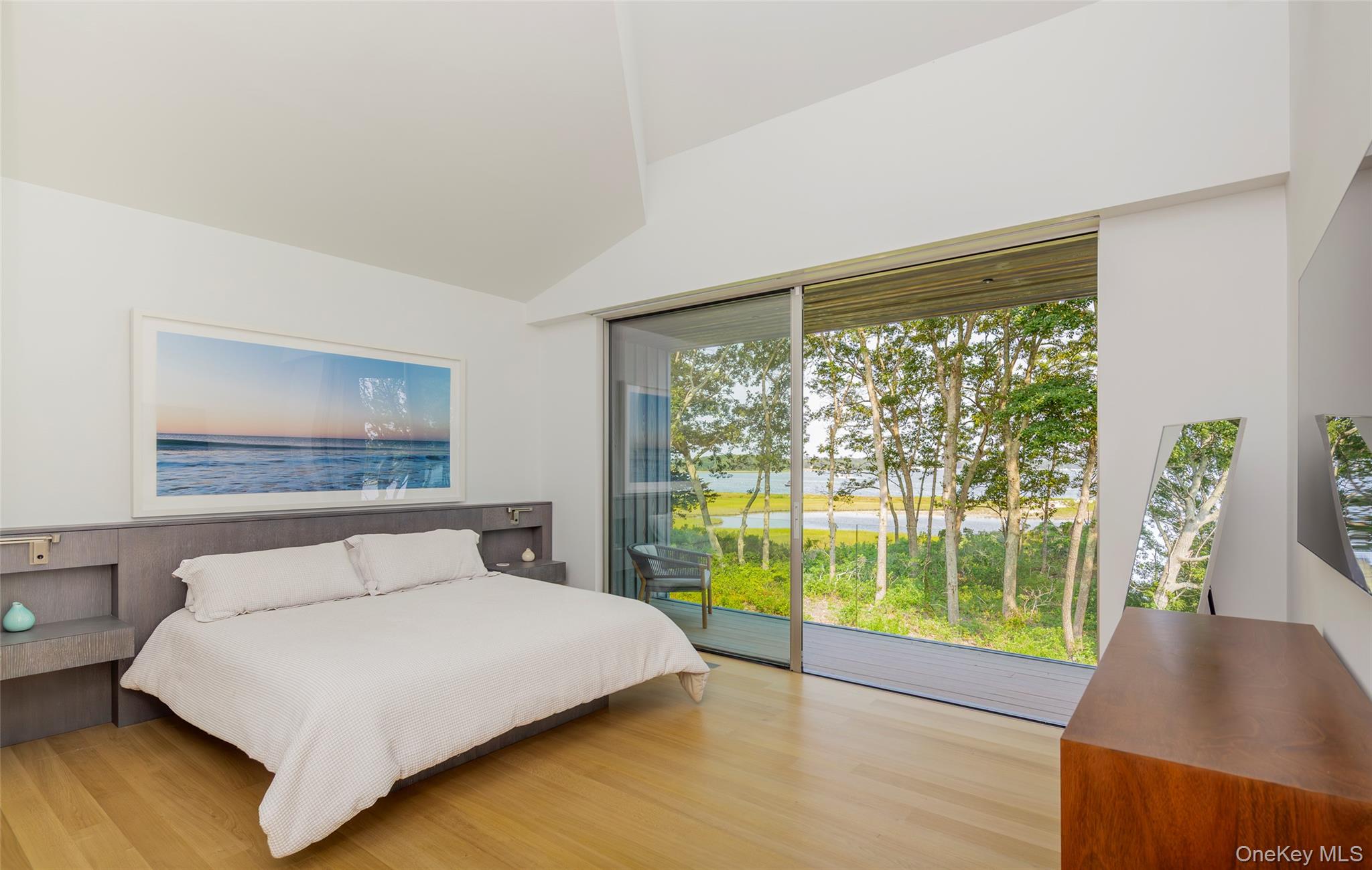 47 L South Ferry Road Shelter Island, NY 11964 - Photo 19 of 38 a bedroom with a bed and a large window