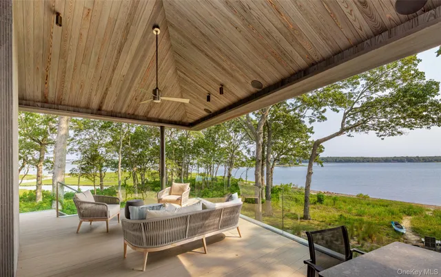 a building outdoor space with patio furniture and wooden floor