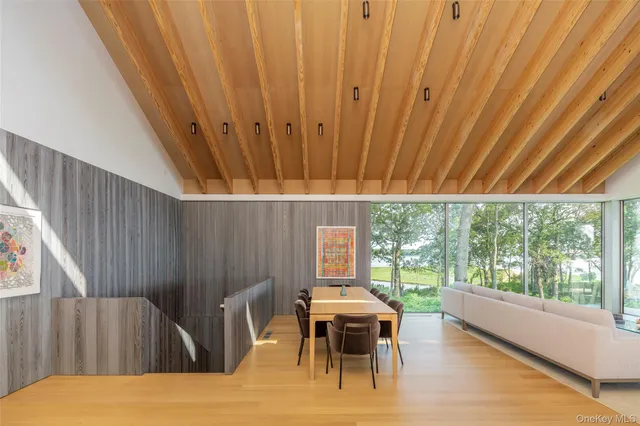 a view of a dining room with furniture window and outside view