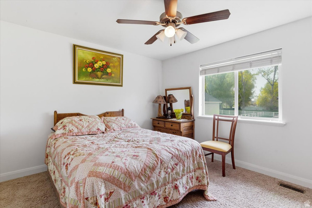 6237 West 4600th Street South Hooper, UT 84315 - Photo 19 of 48 Bedroom with light colored carpet and a ceiling fan