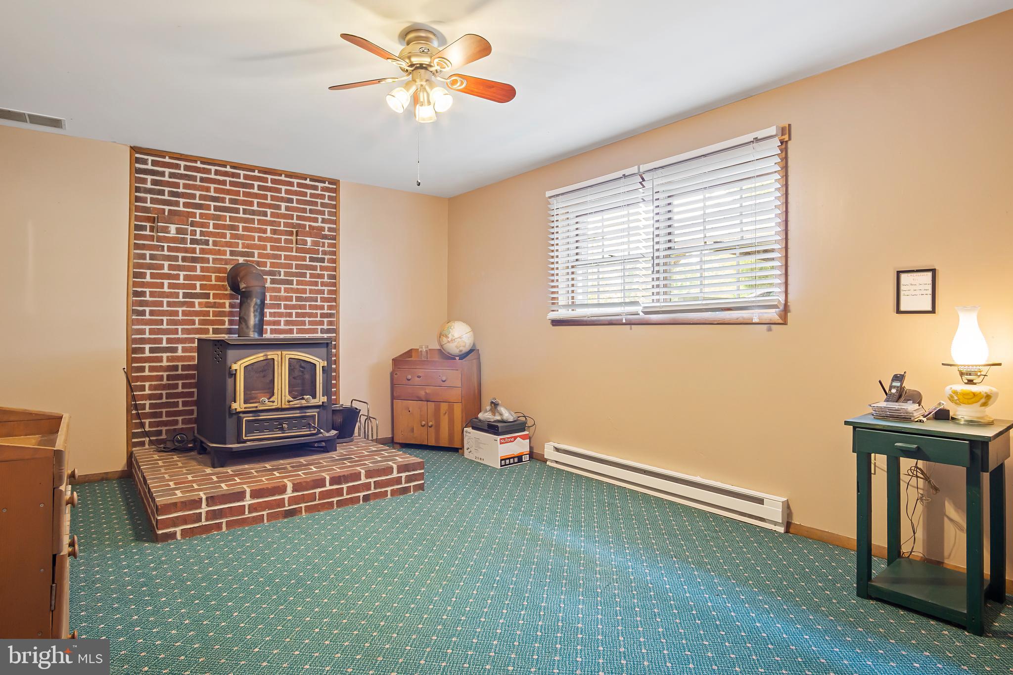 16923 Shinham Road Hagerstown, MD 21740 - Photo 34 of 42 Lower level rec room; coal stove