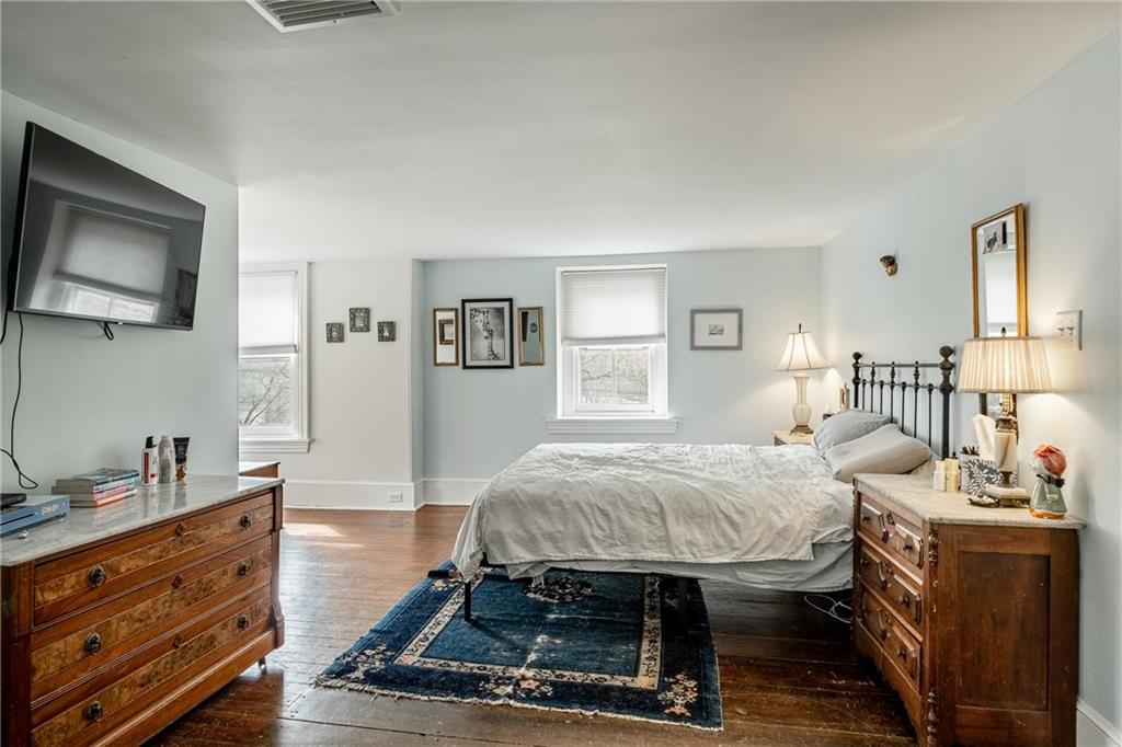 701 Oakbourne Road West Chester, PA 19382 - Photo 28 of 50 a bedroom with a bed a mirror and desk