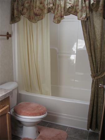 6 Palmer Road Three Rivers, MA 01080 - Photo 9 of 14 a bathroom with a sink toilet and shower
