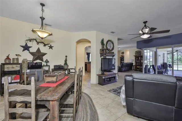 a view of a livingroom with furniture a flat screen tv and couches