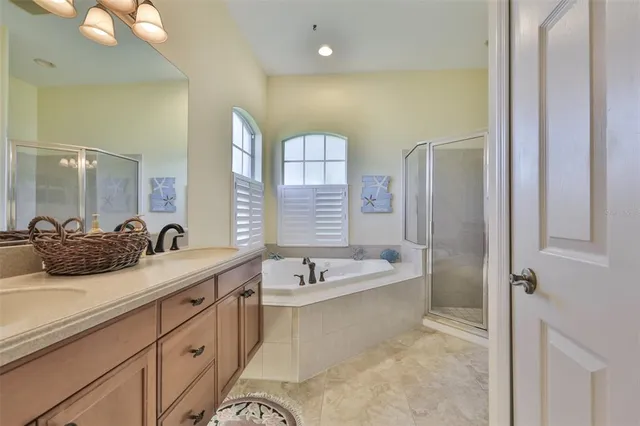 a bathroom with a tub and shower
