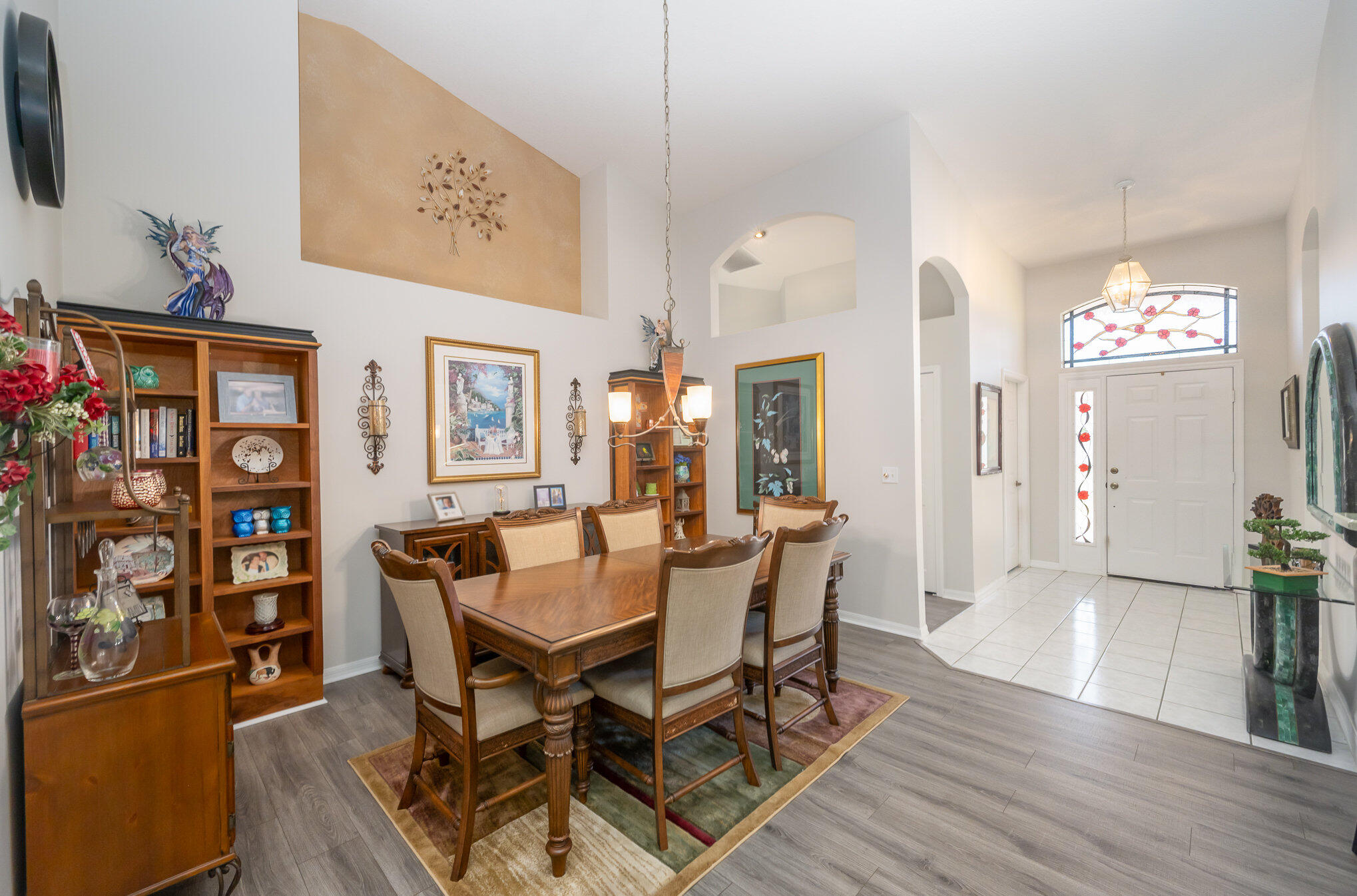 391 Shell Cove Drive Melbourne, FL 32940 - Photo 10 of 37 a view of a dining room with furniture and wooden floor