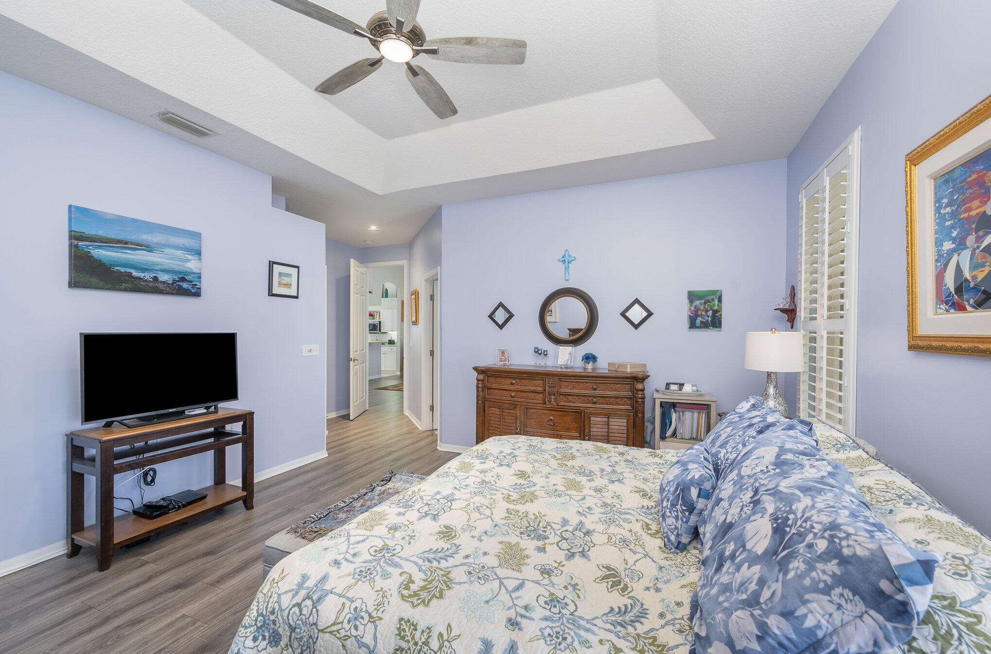 391 Shell Cove Drive Melbourne, FL 32940 - Photo 19 of 37 a bedroom with furniture and flat screen tv