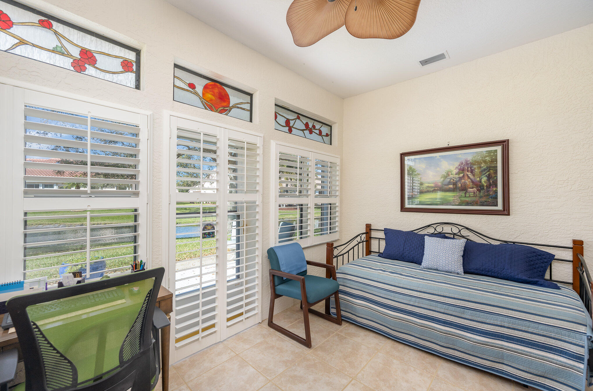 391 Shell Cove Drive Melbourne, FL 32940 - Photo 28 of 37 a living room with furniture and a floor to ceiling window