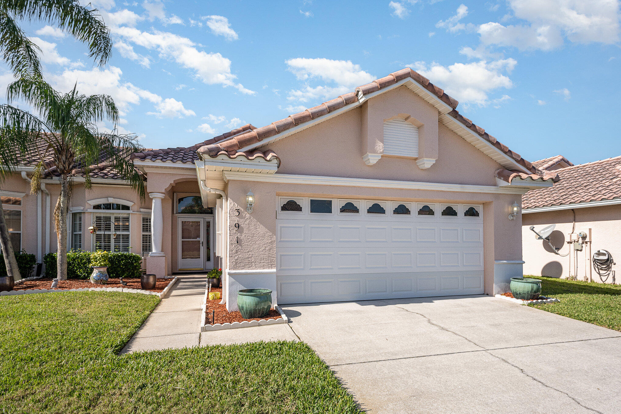 391 Shell Cove Drive Melbourne, FL 32940 - Photo 3 of 37 a front view of a house with a yard