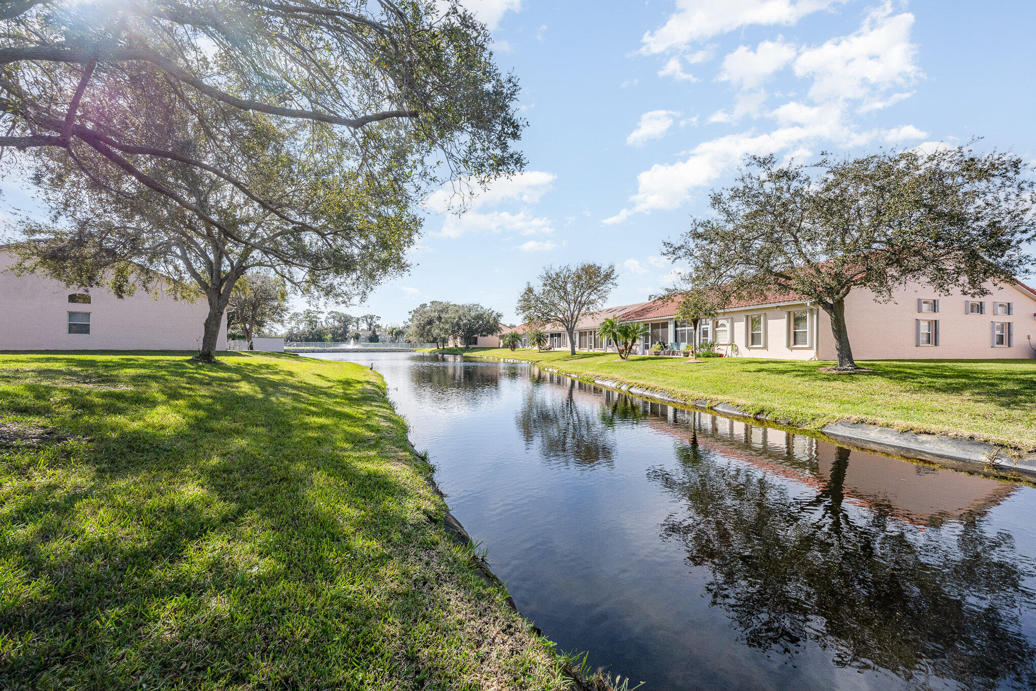 391 Shell Cove Drive Melbourne, FL 32940 - Photo 32 of 37 a view of a lake with a yard