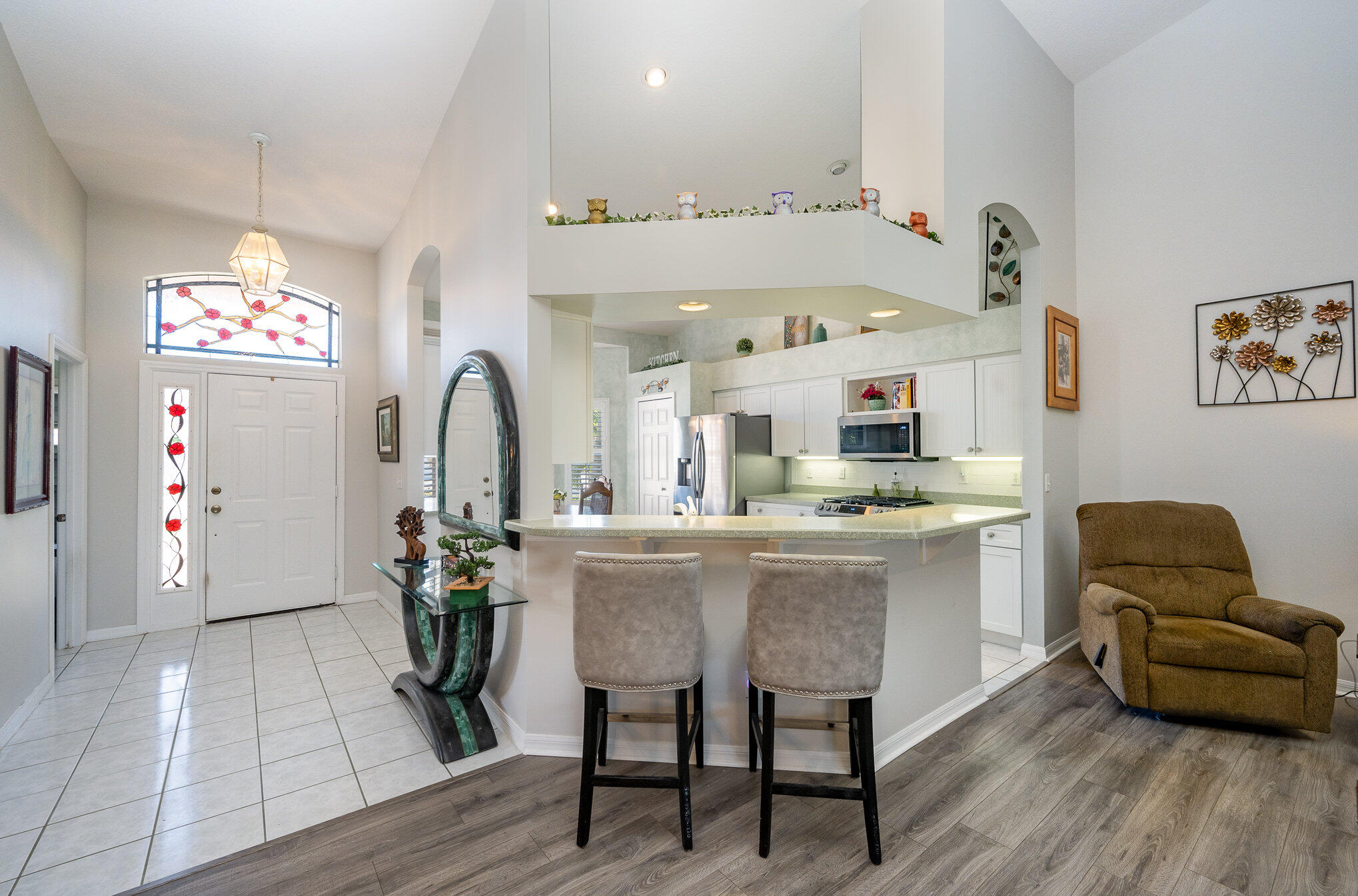 391 Shell Cove Drive Melbourne, FL 32940 - Photo 4 of 37 a living room with furniture and a wooden floor