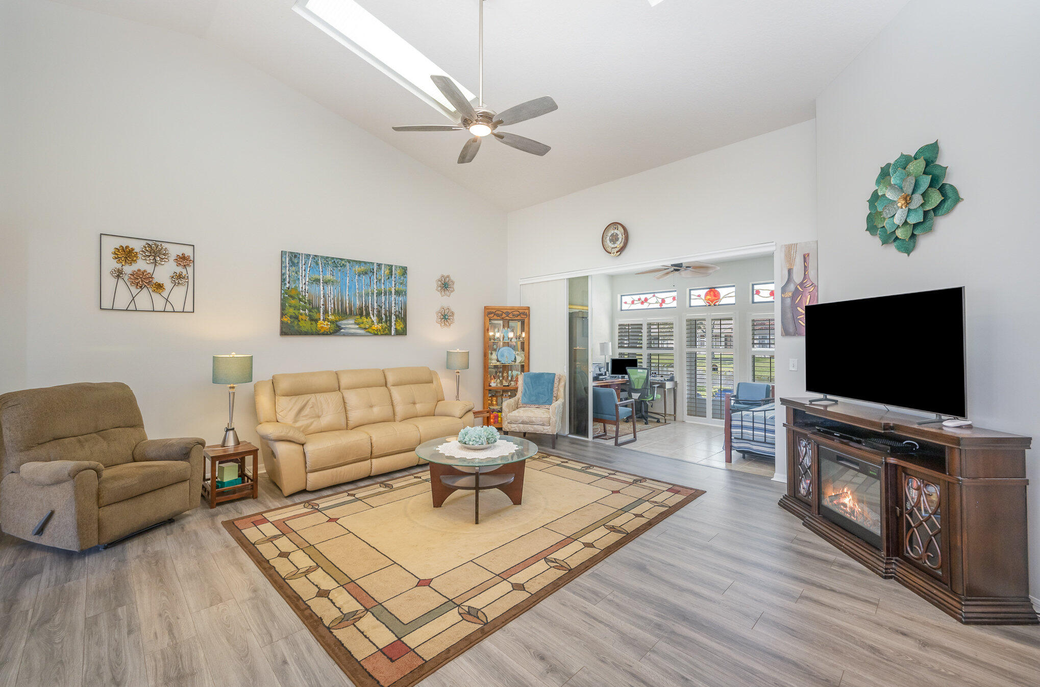 391 Shell Cove Drive Melbourne, FL 32940 - Photo 6 of 37 a living room with furniture and a flat screen tv