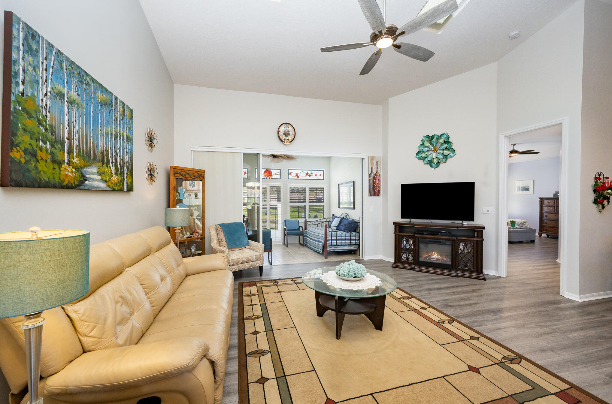 391 Shell Cove Drive Melbourne, FL 32940 - Photo 7 of 37 a living room with furniture and a flat screen tv