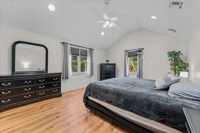 a view of a backyard with swimming pool