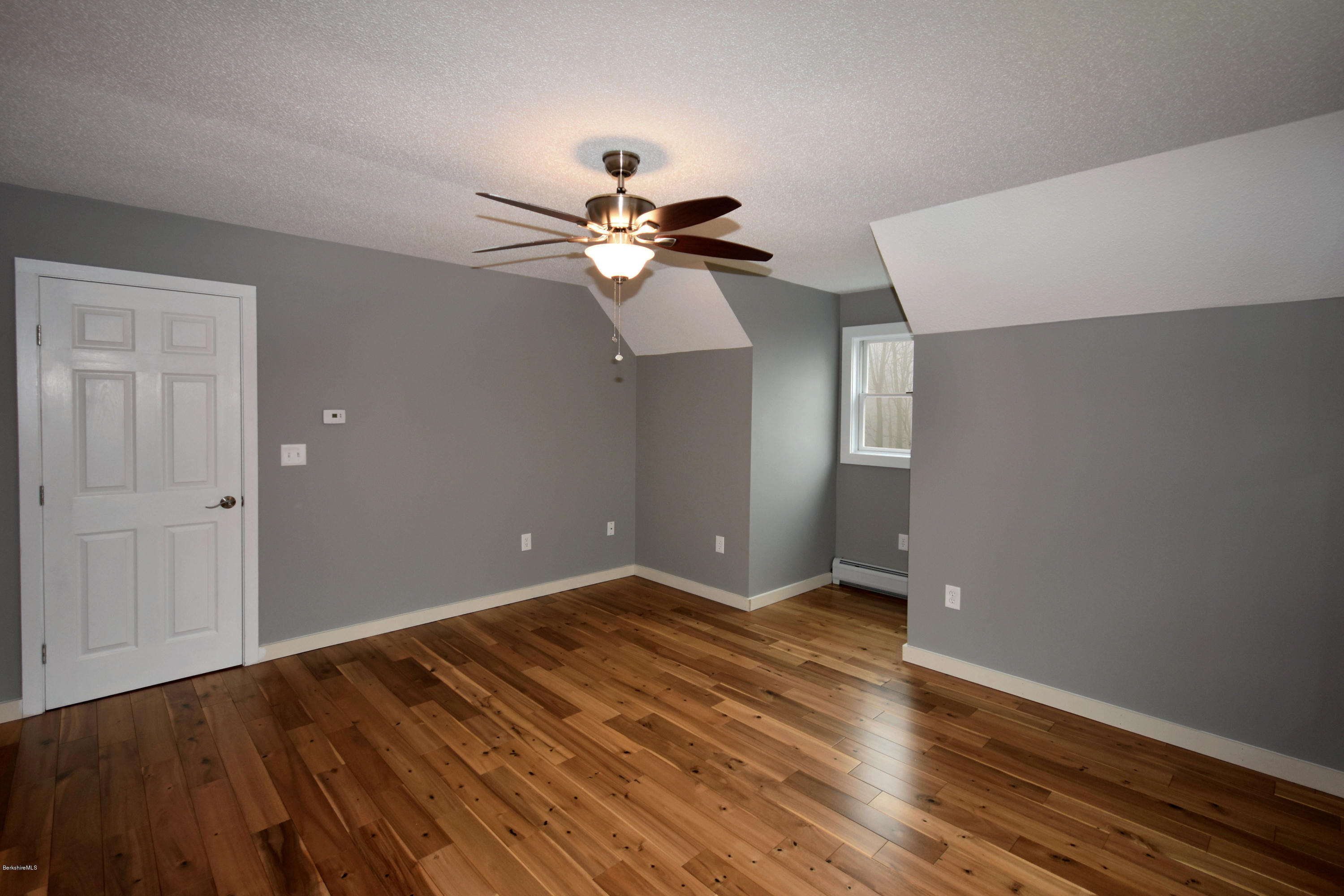 1246 Jacobs Ladder Road Becket, MA 01223 - Photo 34 of 54 a view of an empty room with wooden floor
