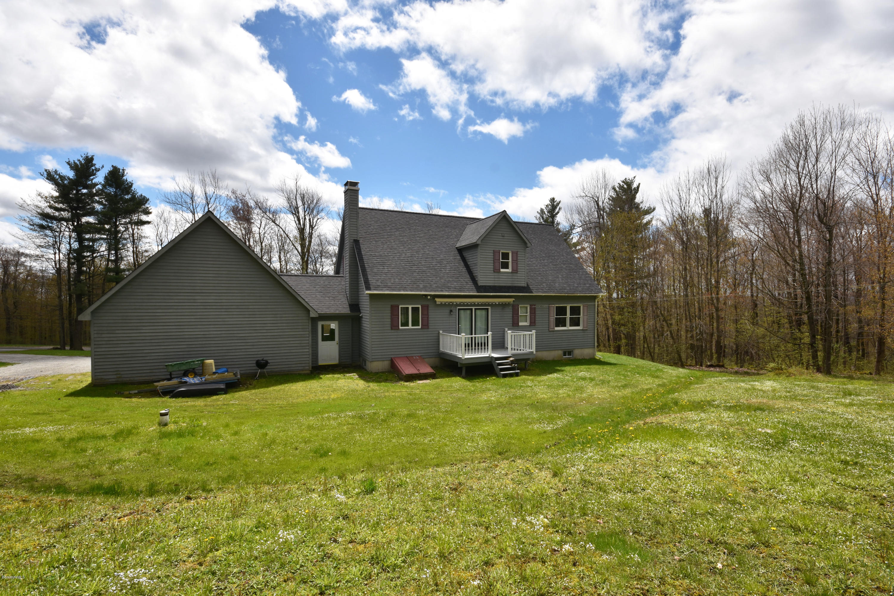 1246 Jacobs Ladder Road Becket, MA 01223 - Photo 48 of 54 a view of a house with a yard