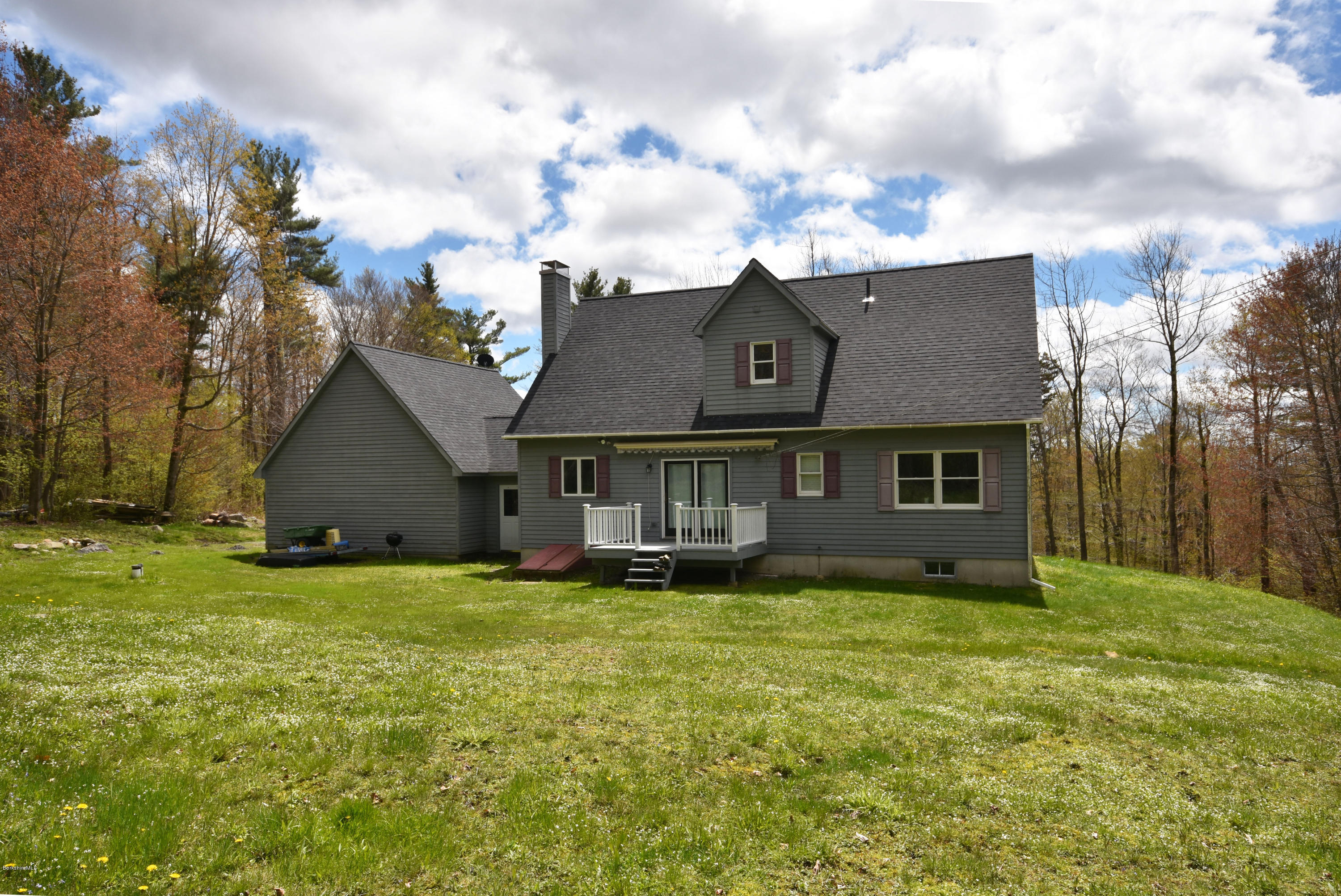 1246 Jacobs Ladder Road Becket, MA 01223 - Photo 50 of 54 a view of a house with a yard