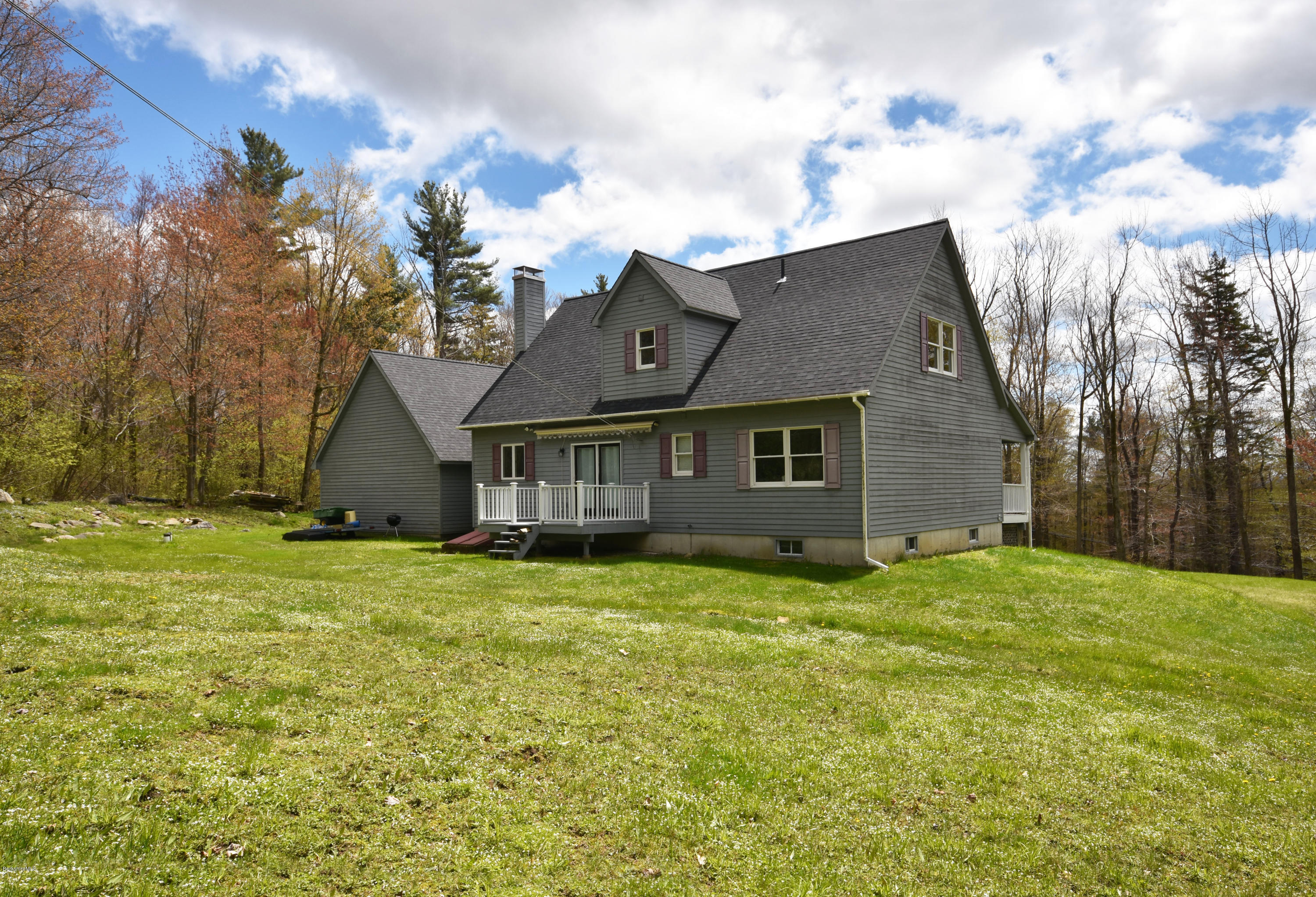 1246 Jacobs Ladder Road Becket, MA 01223 - Photo 51 of 54 a view of a house with a yard