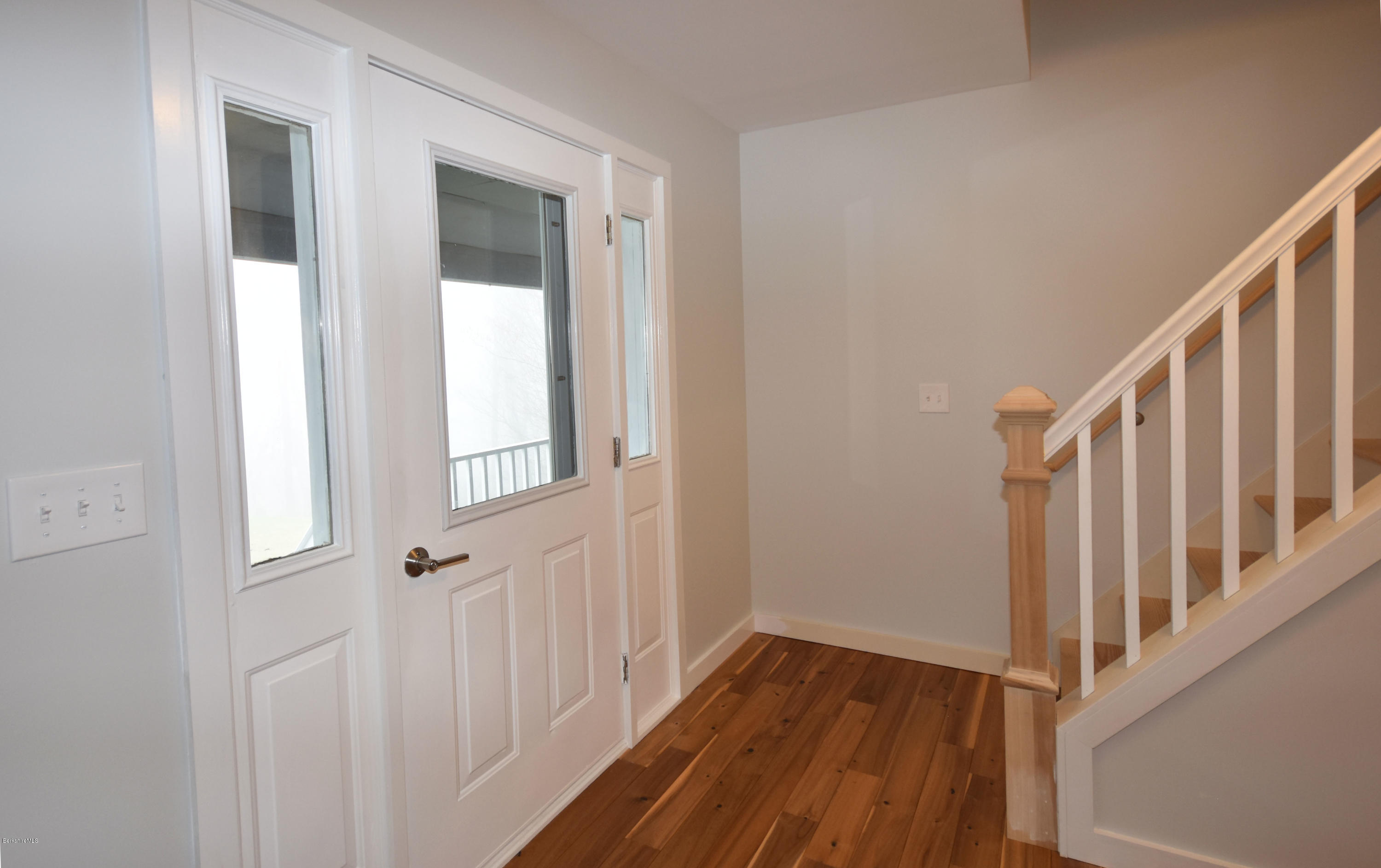 1246 Jacobs Ladder Road Becket, MA 01223 - Photo 8 of 54 a view of a hallway with wooden floor and entryway