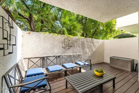 swimming pool view with a seating space