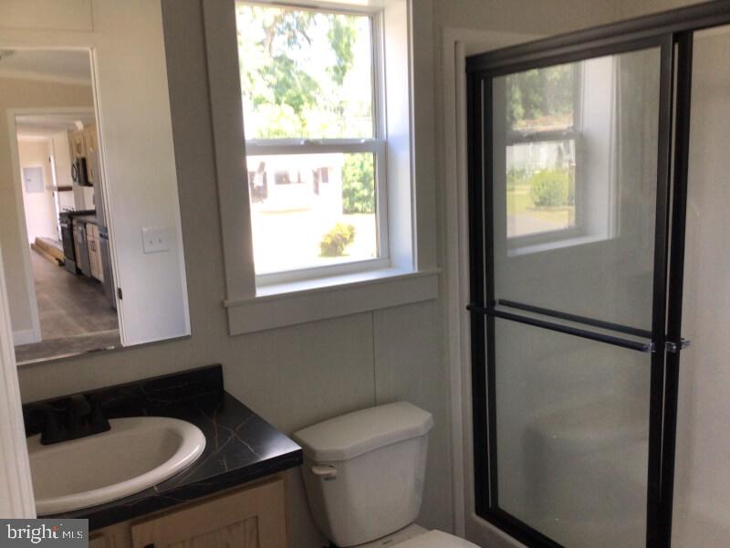 4222 Darby Drive Morrisville, PA 19067 - Photo 11 of 14 a bathroom with a toilet a sink and a window