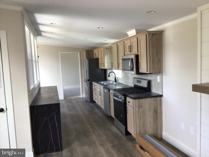 4222 Darby Drive Morrisville, PA 19067 - Photo 5 of 14 a kitchen with stainless steel appliances granite countertop a stove a sink and a refrigerator