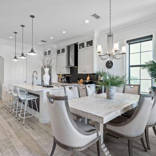1922 Baytowne Loop Miramar Beach, FL 32550 - Photo 11 of 55 a kitchen with a dining table chairs stove and kitchen view