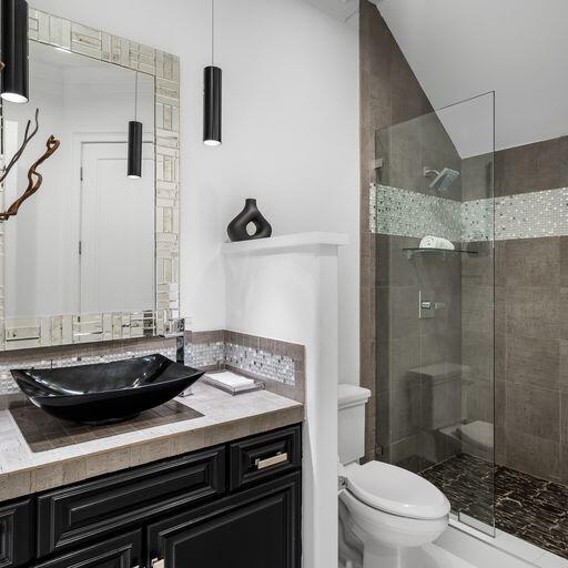 1922 Baytowne Loop Miramar Beach, FL 32550 - Photo 17 of 55 a bathroom with a sink a toilet and shower