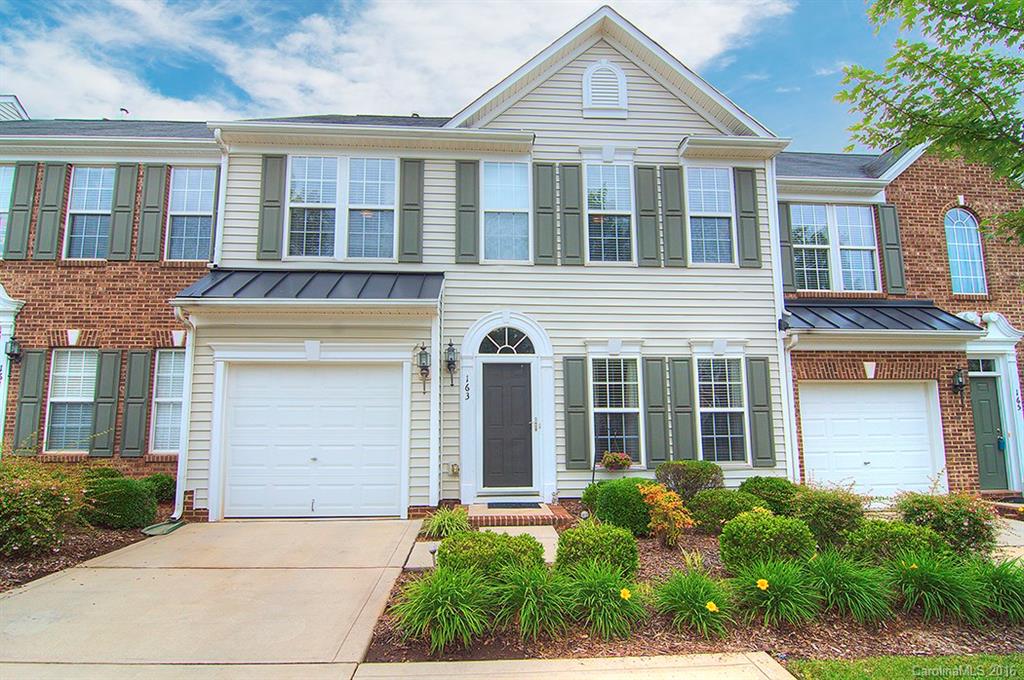 163 Snead Road, Unit 163 Fort Mill, SC 29715 - Photo 1 of 24 a front view of a house with garden