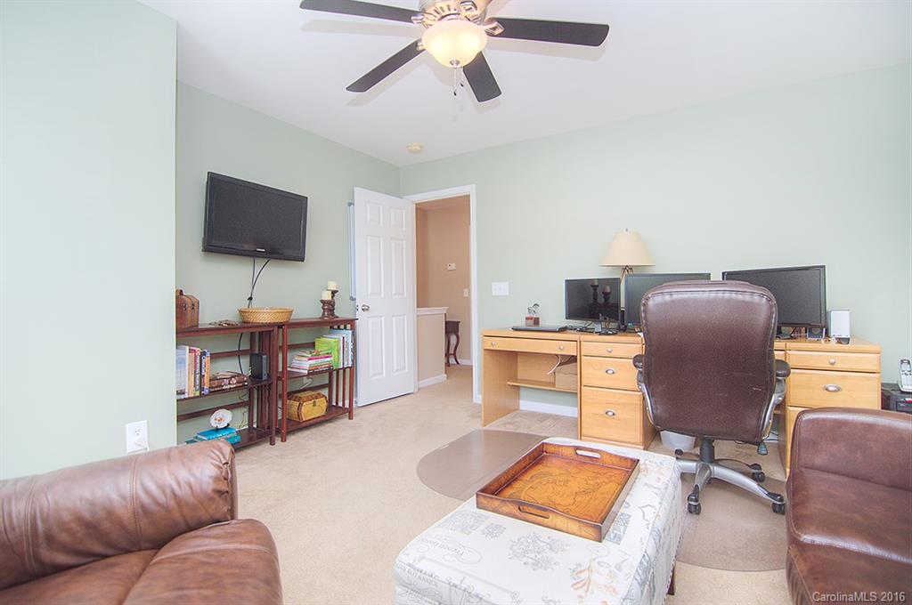 163 Snead Road, Unit 163 Fort Mill, SC 29715 - Photo 17 of 24 a living room with furniture and a flat screen tv