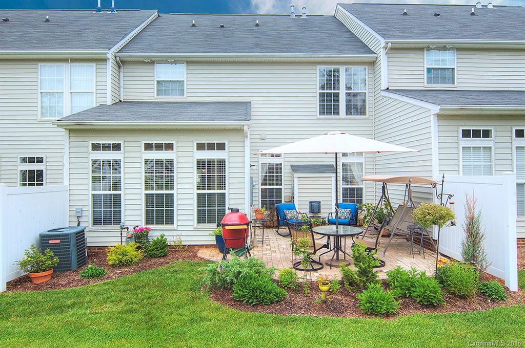 163 Snead Road, Unit 163 Fort Mill, SC 29715 - Photo 21 of 24 a front view of house with yard and outdoor seating