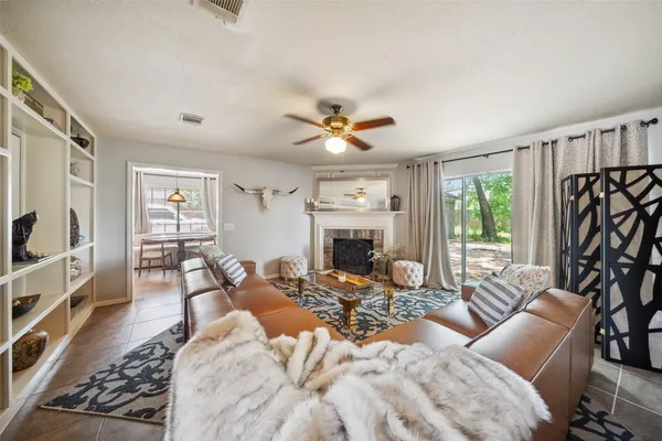 a living room with furniture and a fireplace