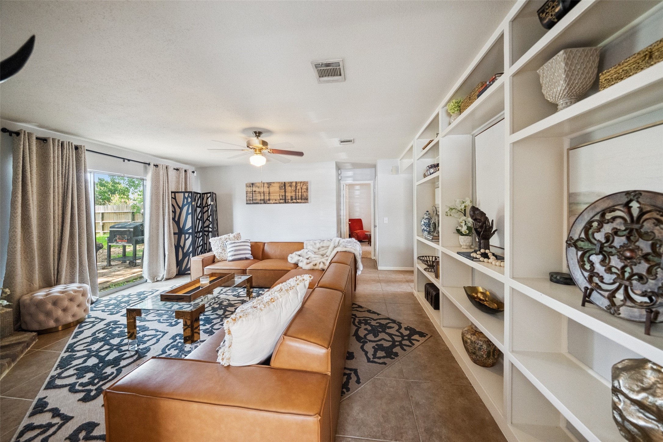 20407 Weald Way Street Spring, TX 77388 - Photo 14 of 31 a living room with furniture and a window