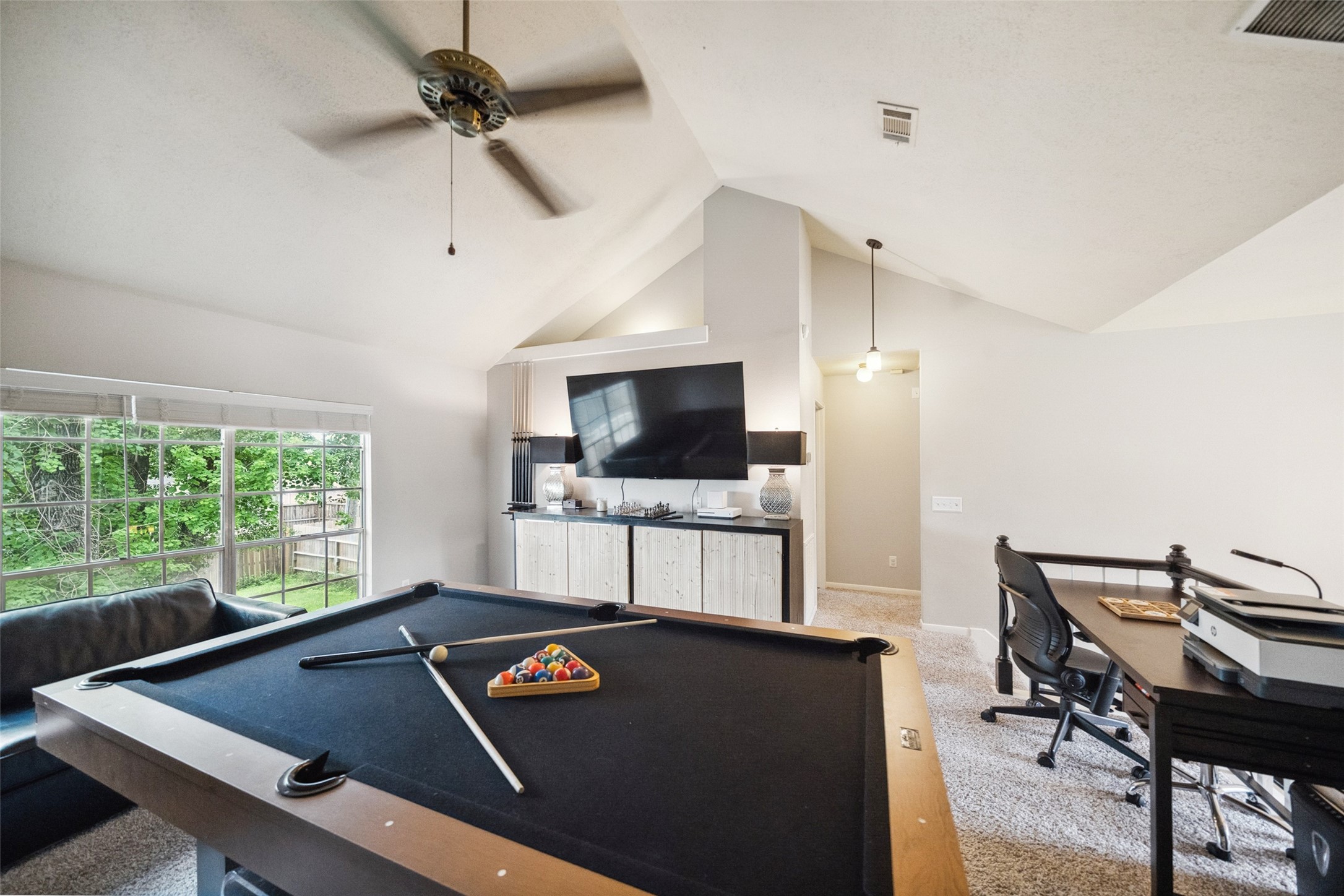 20407 Weald Way Street Spring, TX 77388 - Photo 22 of 31 a living room with furniture and a flat screen tv