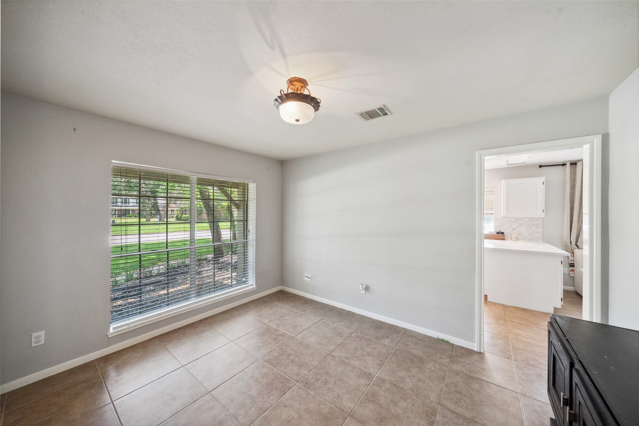 20407 Weald Way Street Spring, TX 77388 - Photo 6 of 31 an empty room with windows