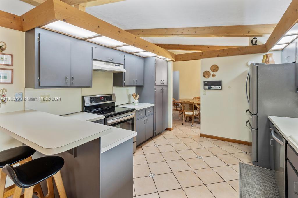 The Hammocks Miami, FL 33186 - Photo 12 of 62 a kitchen with a sink a refrigerator and cabinets