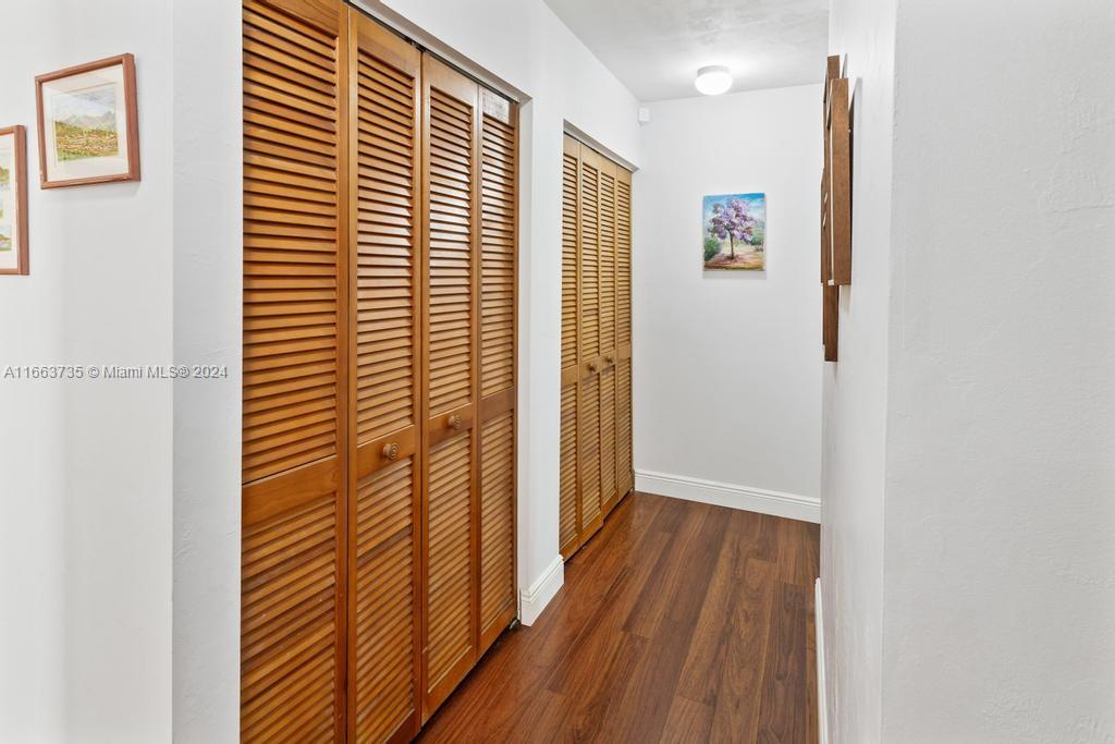 The Hammocks Miami, FL 33186 - Photo 20 of 62 a view of a hallway with wooden floor and a large window