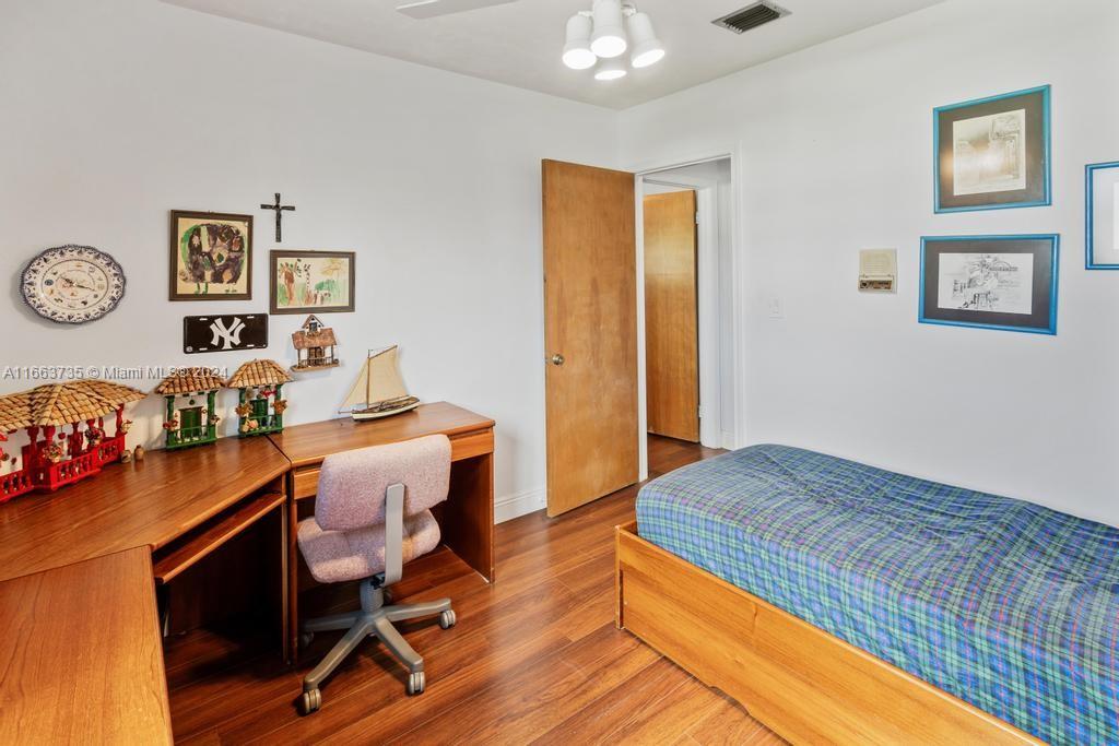 The Hammocks Miami, FL 33186 - Photo 23 of 62 a bedroom with a bed and a table in it