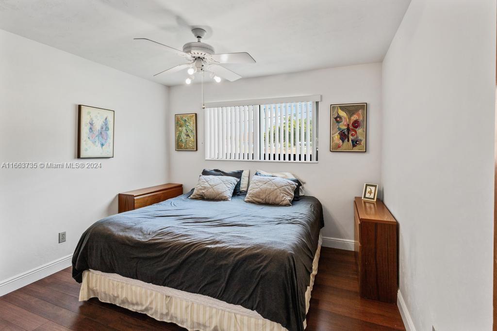 The Hammocks Miami, FL 33186 - Photo 27 of 62 a bedroom with a bed and a chandelier