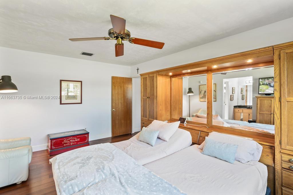 The Hammocks Miami, FL 33186 - Photo 33 of 62 a bedroom with a large bed and a chandelier